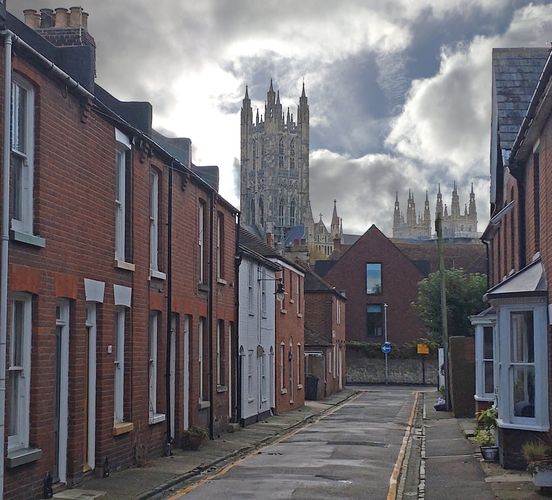 Photo of Canterbury Cathedral in Kent behind a lane of houses